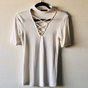 Deep V-neck short sleeve shirt.